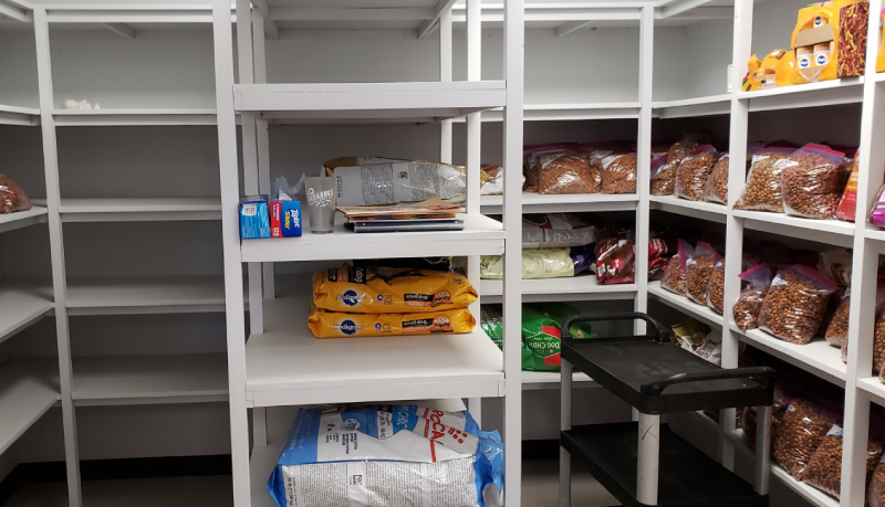 50th Anniversary look: Pet food pantry with shelving and bags of pet food