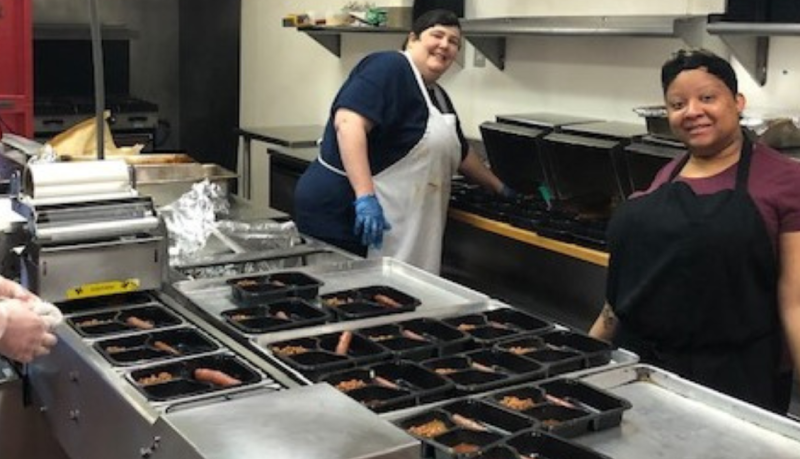 Employees packing meals at Kannapolis location