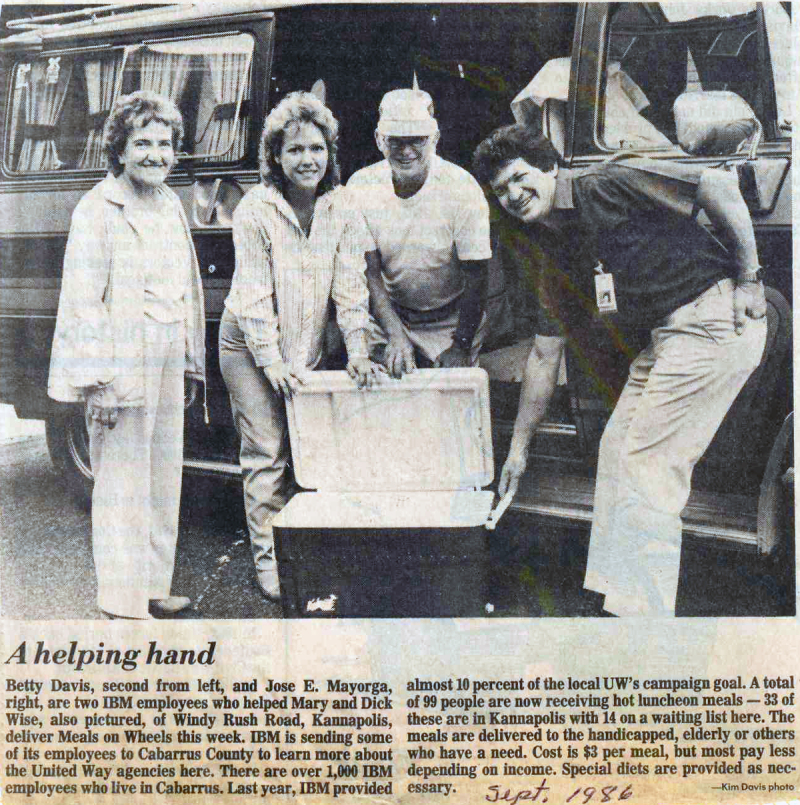 50th Anniversary look back: Newspaper clipping of IBM employees volunteering with a cooler
